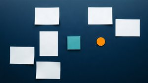 Abstract editorial illustration of blank mortgage content-review cards with teal and orange markers on navy
