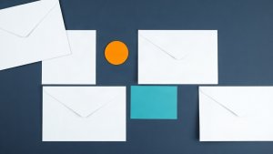 Abstract editorial illustration of blank direct mail review cards with teal and orange markers on navy