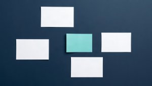 Abstract editorial illustration of blank mortgage marketing review cards with teal and orange markers on navy